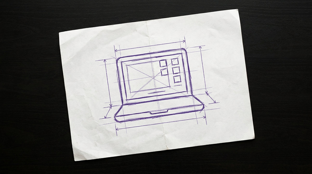 a laptop computer displaying a video conference call on its open screen