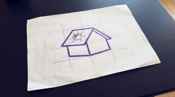 a simple, gabled-roof house, viewed from the front, with a single, circular impact crater on one side of its roof