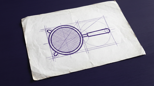 a circular sieve with a fine wire mesh screen held within a metal rim, with a single, straight handle extending from one side