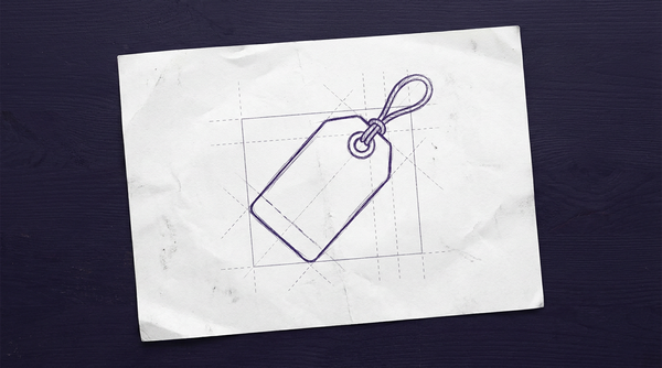 a simple, rectangular paper tag with a circular, reinforced hole on one end through which a knotted loop of string is tied