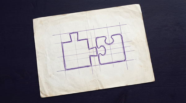a set of two standard jigsaw puzzle pieces, placed next to each other, with their adjacent interlocking edges being clearly incompatible and unable to fit together