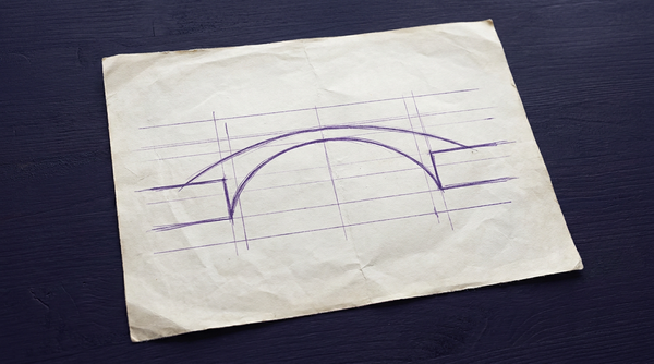 a simple arch bridge viewed from the side, spanning a gap between two level pieces of land