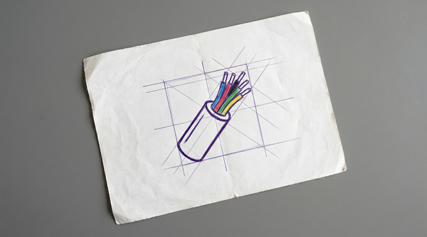 a short length of electrical cable with its outer insulation sheath cut away to reveal the bundle of smaller, color-coded inner wires