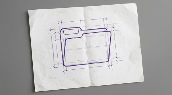 a medical file folder, closed and viewed from the front, with a blank rectangular label affixed to its tab