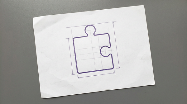 a single, flat, square-shaped jigsaw puzzle piece, viewed from above, with a single connection tab protruding from its top edge and a corresponding socket indented into its right edge