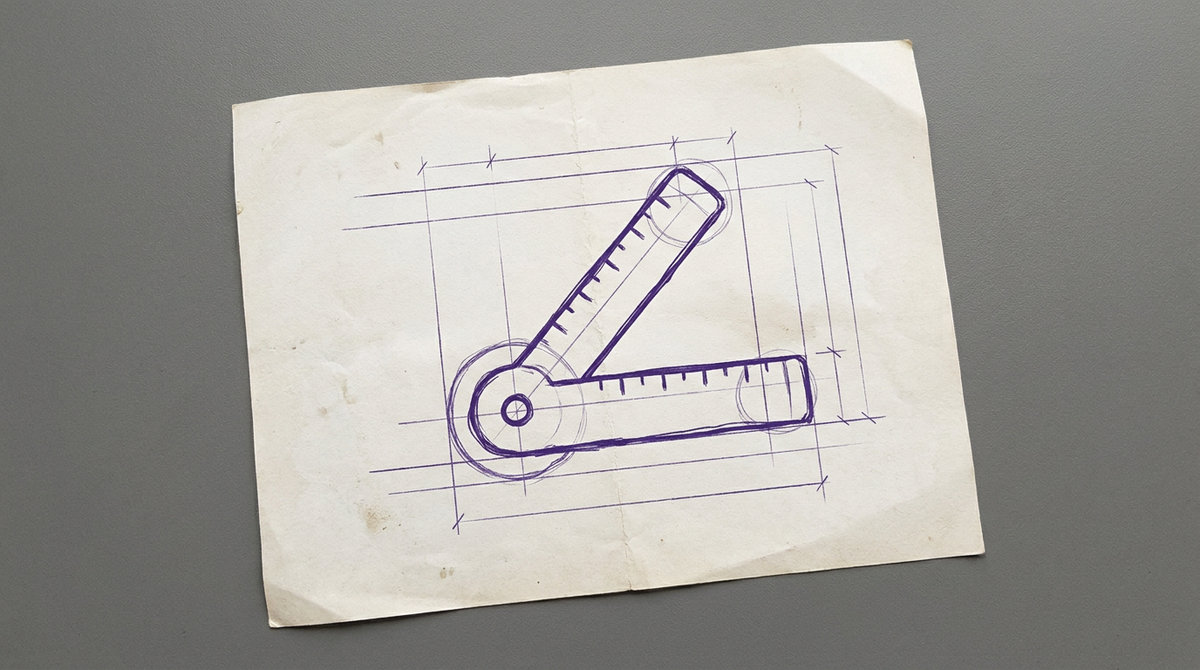a standard medical goniometer, consisting of two straight ruler arms connected by a circular protractor hinge for measuring joint range of motion