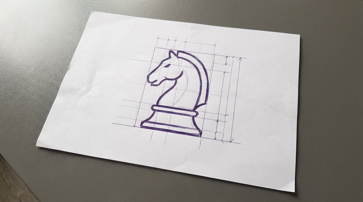 a classic chess knight piece sculpted in the profile of a horse head resting on a flared circular base